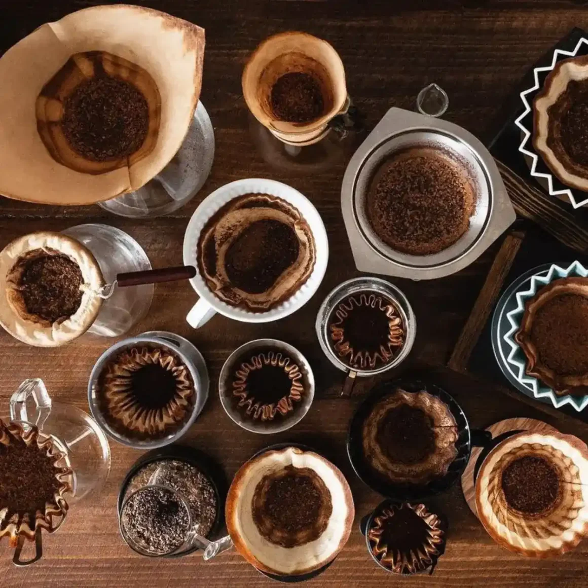 a table with coffee filter and cups