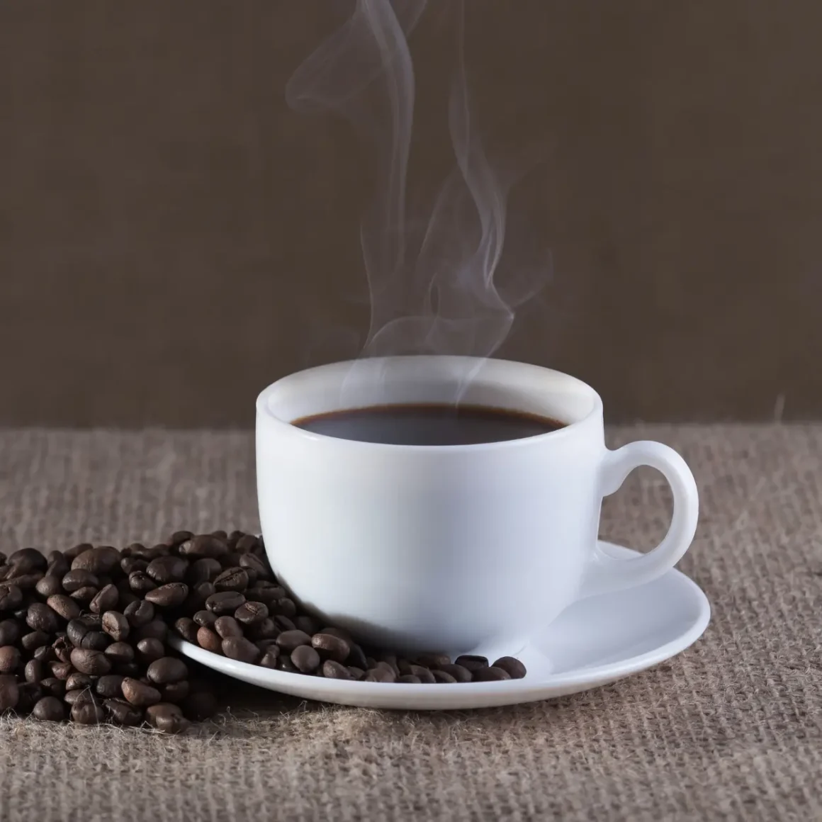 a cup of coffee with smoke and coffee beans