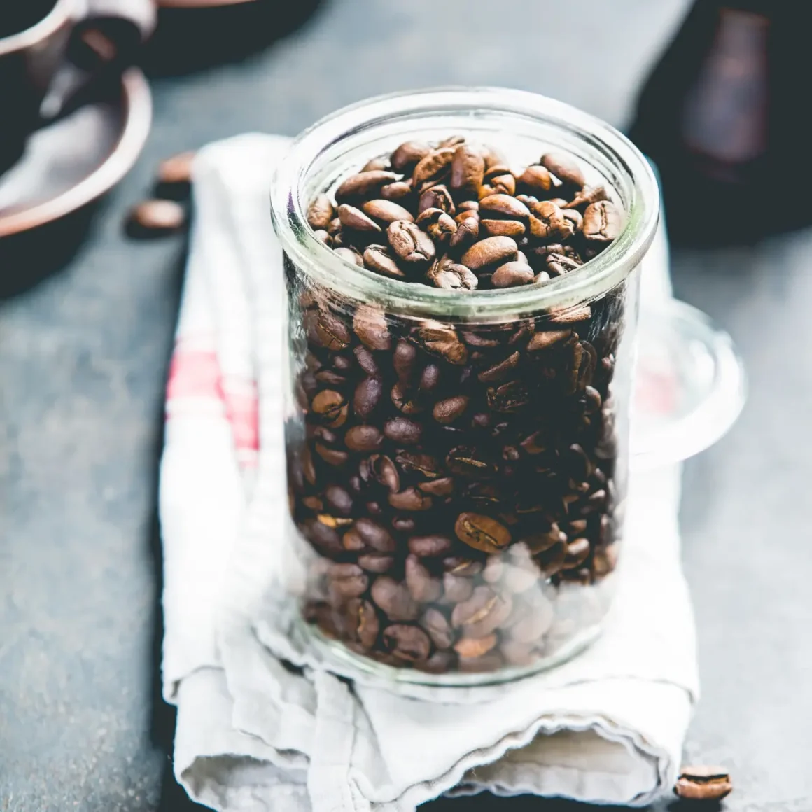 a jar of coffee beans being stored away properly