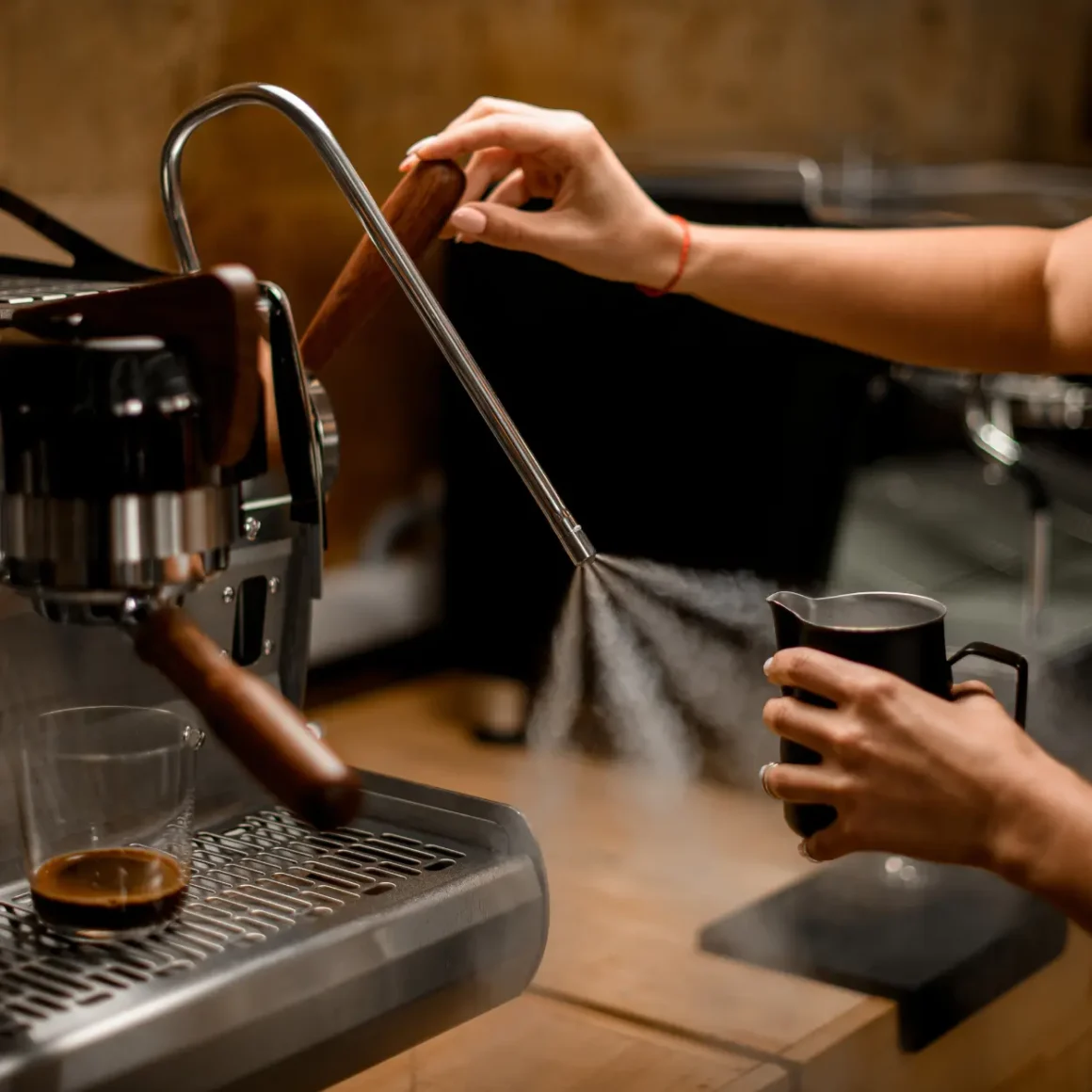 barista using the an espresso machine