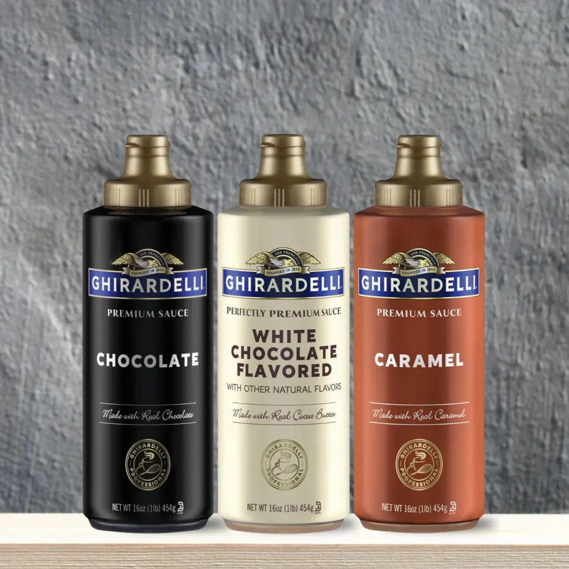 a group of bottles coffee syrups by ghiradelli