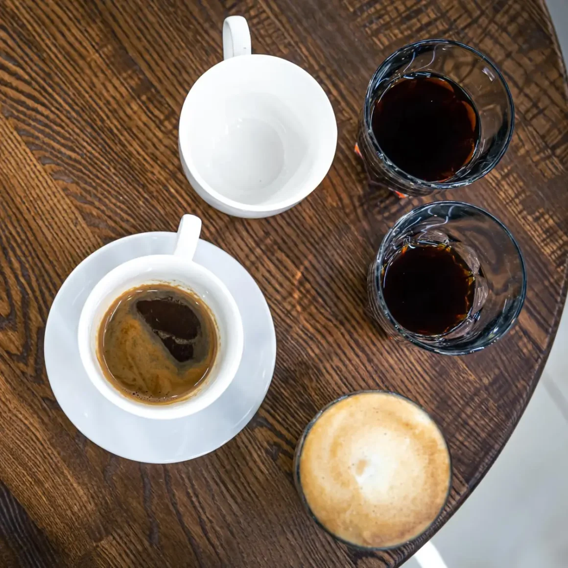 a group of espresso cups on a table