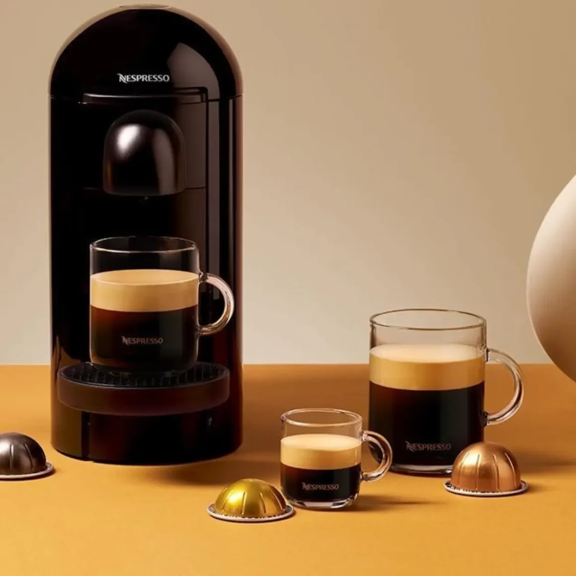 a coffee machine with cups of coffee