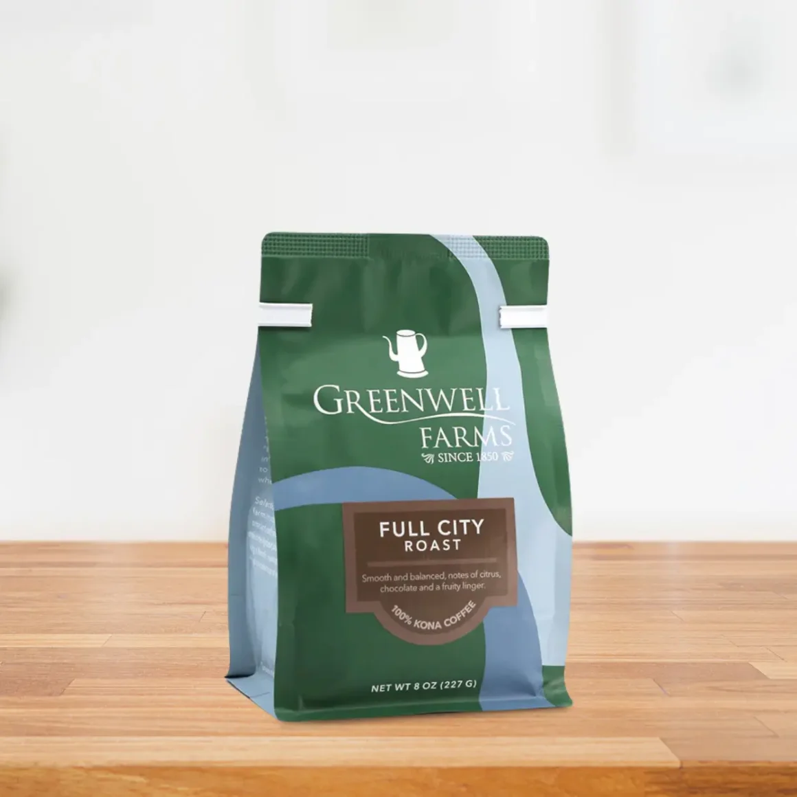 a bag of greenwell farms hawaiian kona coffee on a table