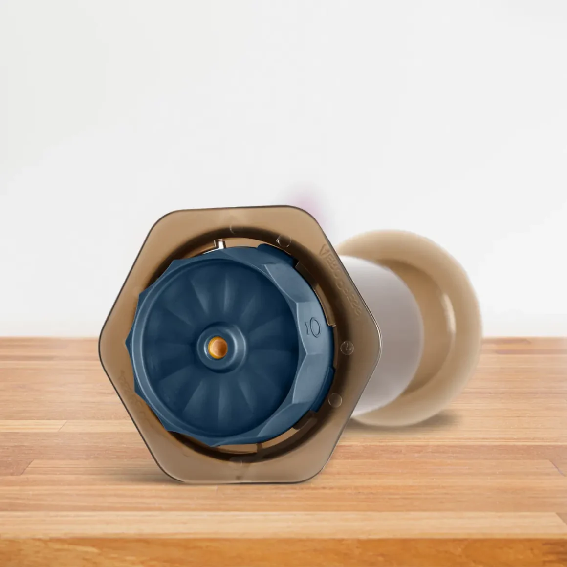 a close up of a coffee maker with a fellow prismo flow control filter cap attached with it