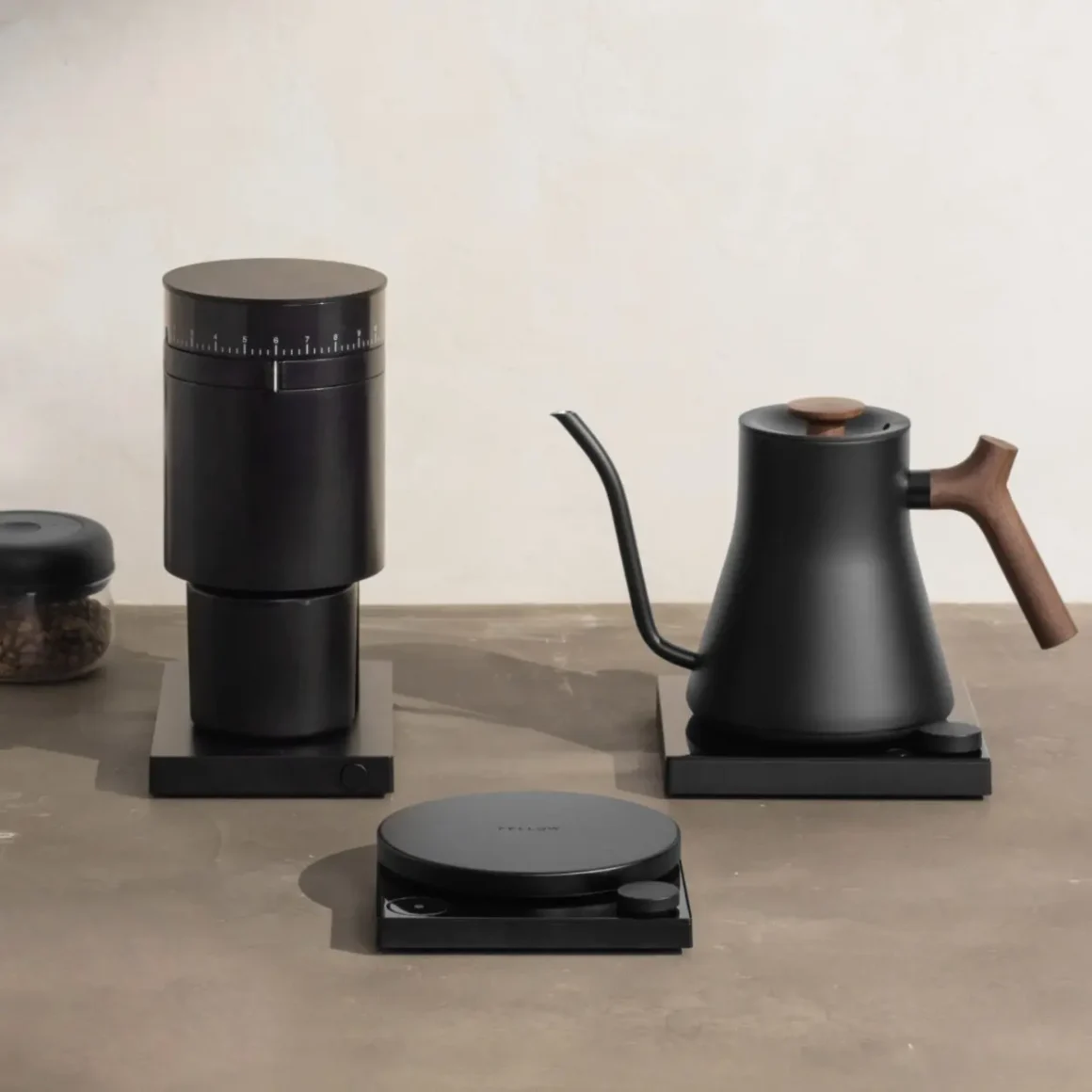 a black fellow stagg ekg electric kettle and coffee grinder on a table