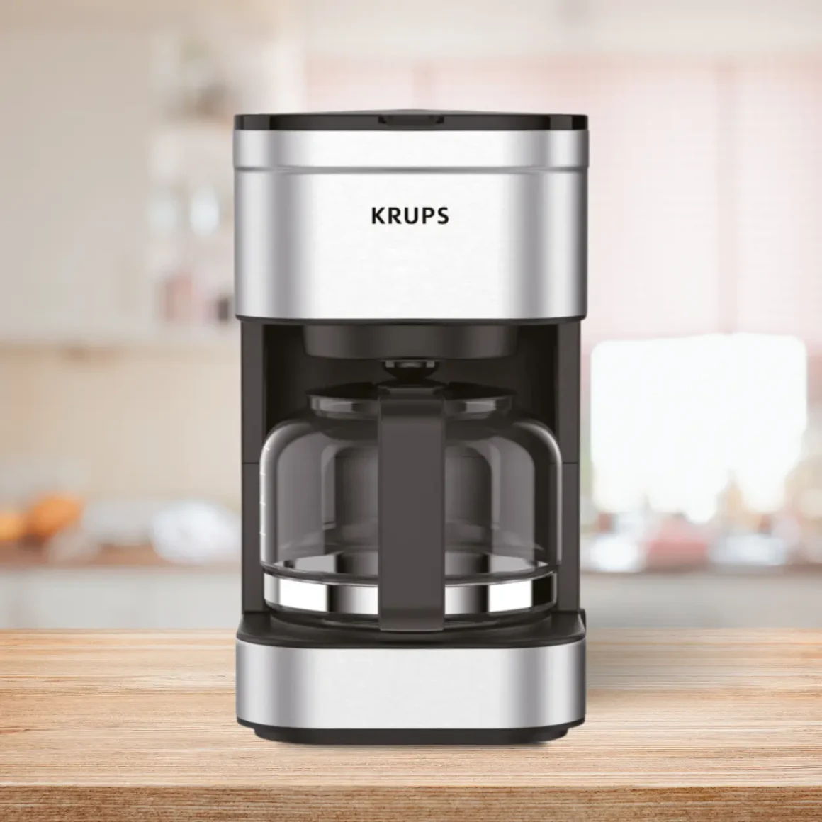 a krups simply brew 5-cup coffee maker on a table
