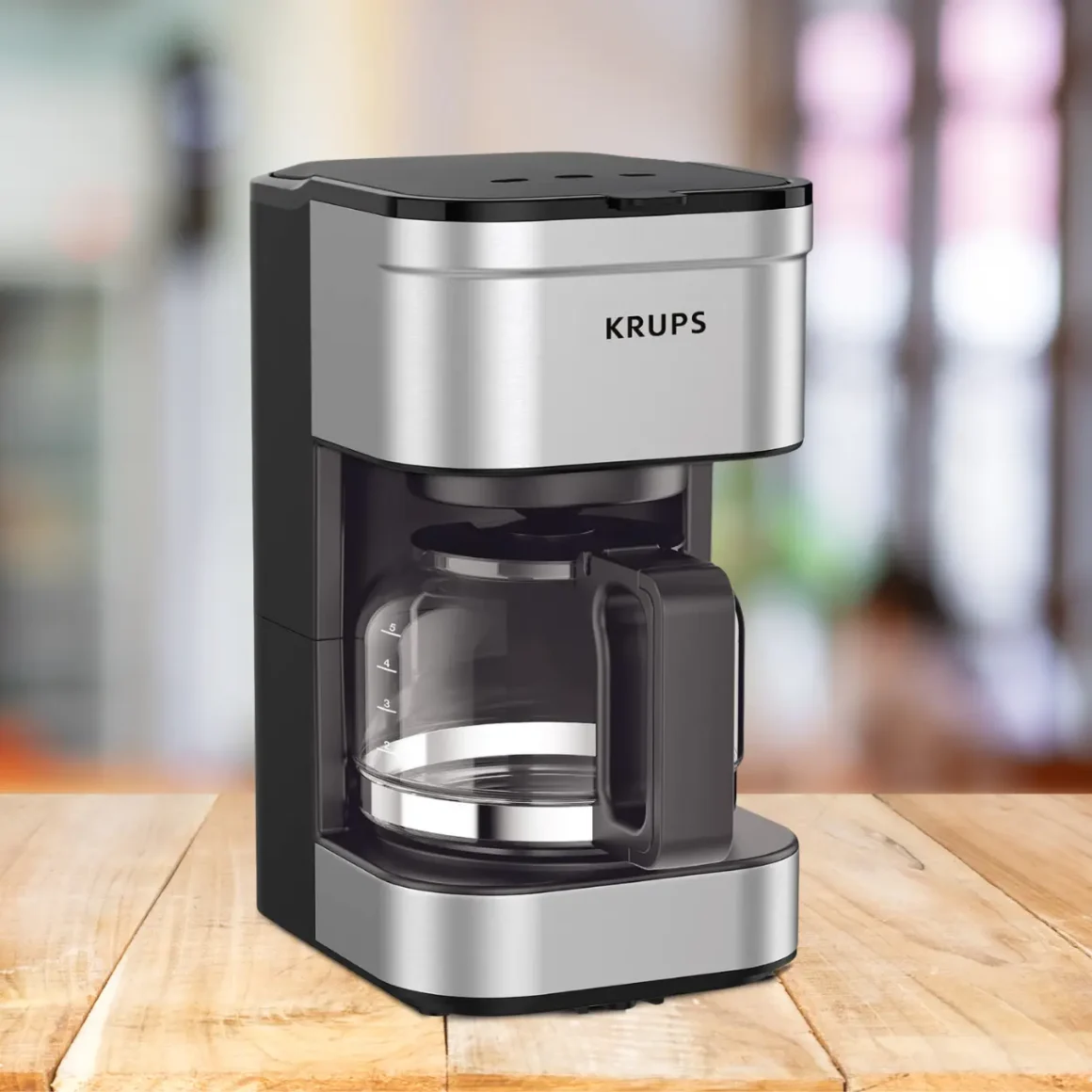 a krups simply brew 5-cup coffee maker on a table