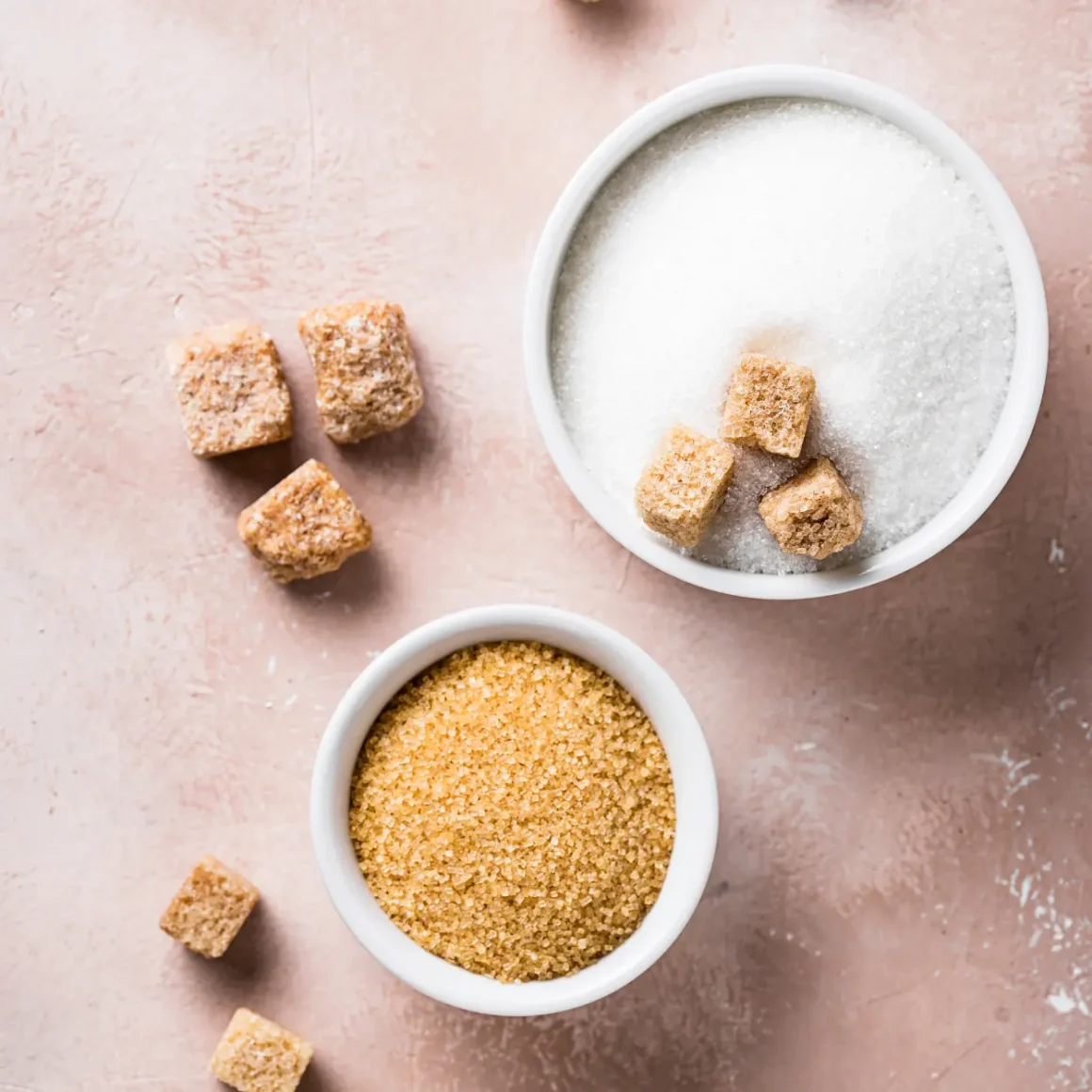 a group of bowls of sugar and brown sugar