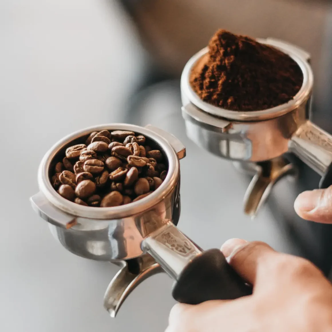 a coffee beans and ground coffee in a portafilter