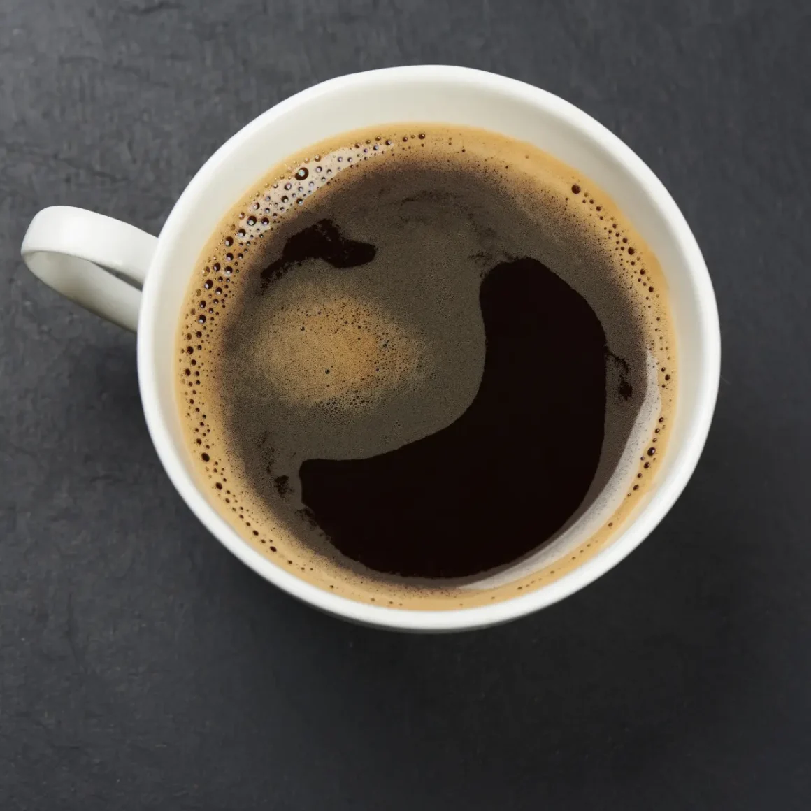 a cup of coffee with foam