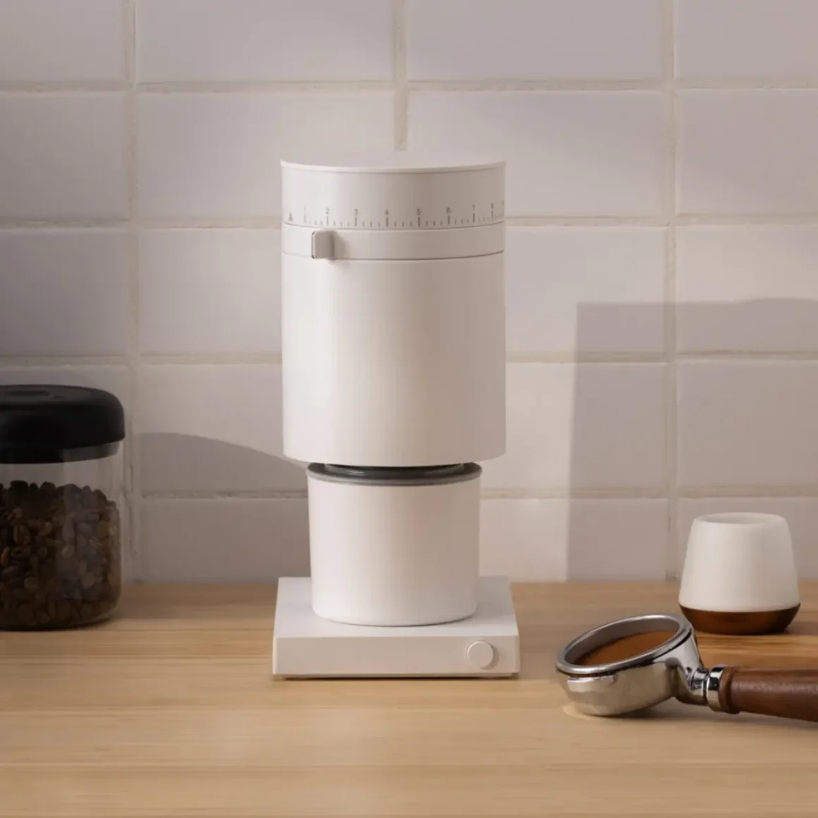 a fellow opus coffee grinder on a counter