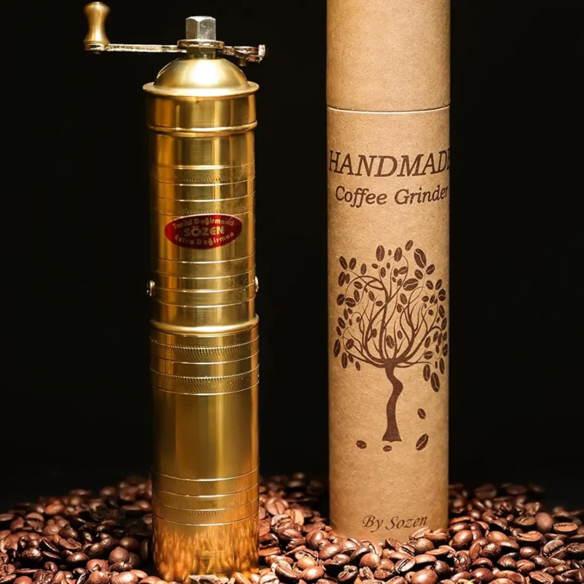 a sozen turkish coffee grinder and a cardboard box on beans