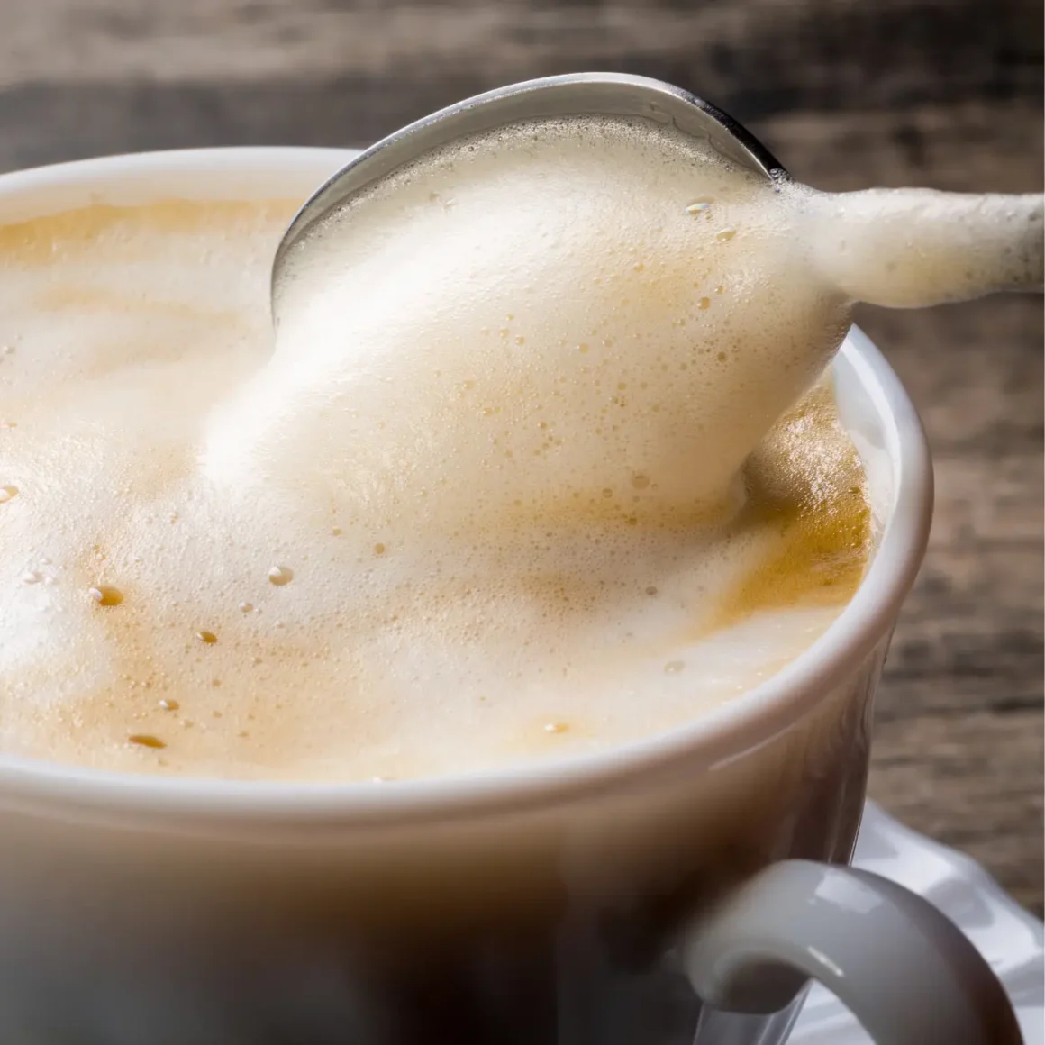 a spoon in a cup of coffee