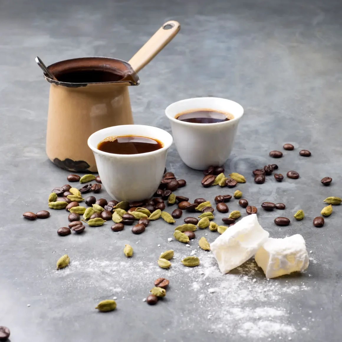 two coffee cups of turkish and arabic coffee and coffee beans