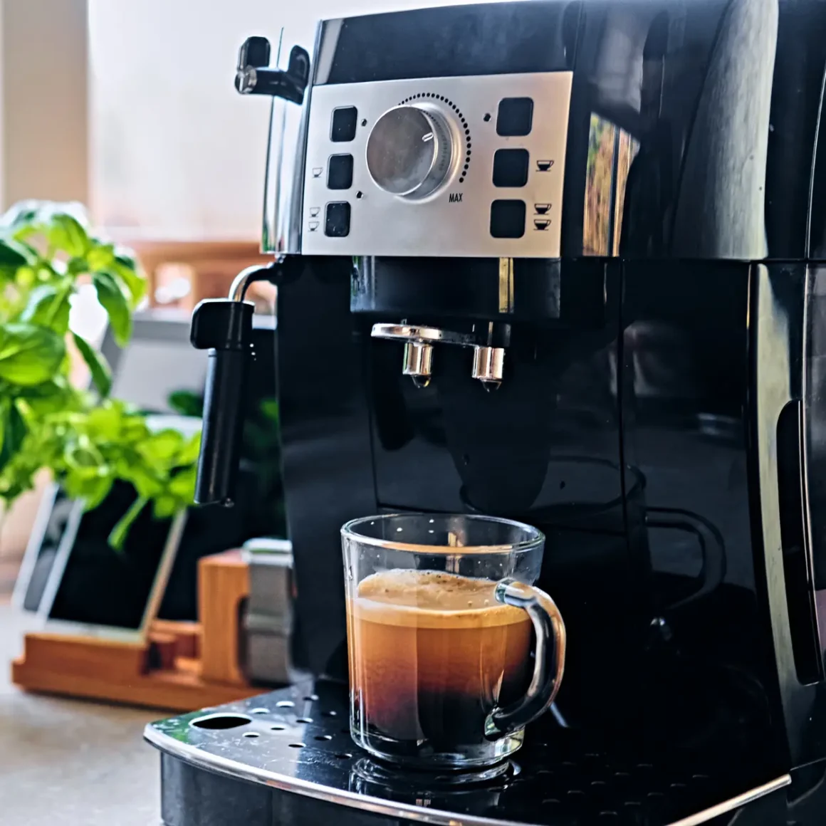 a coffee machine with a glass of coffee