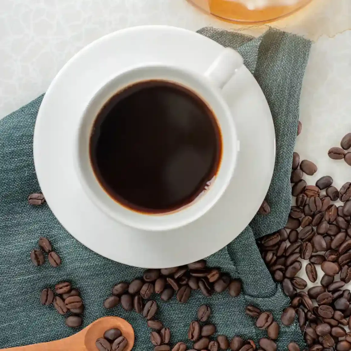 a cup of coffee and coffee beans