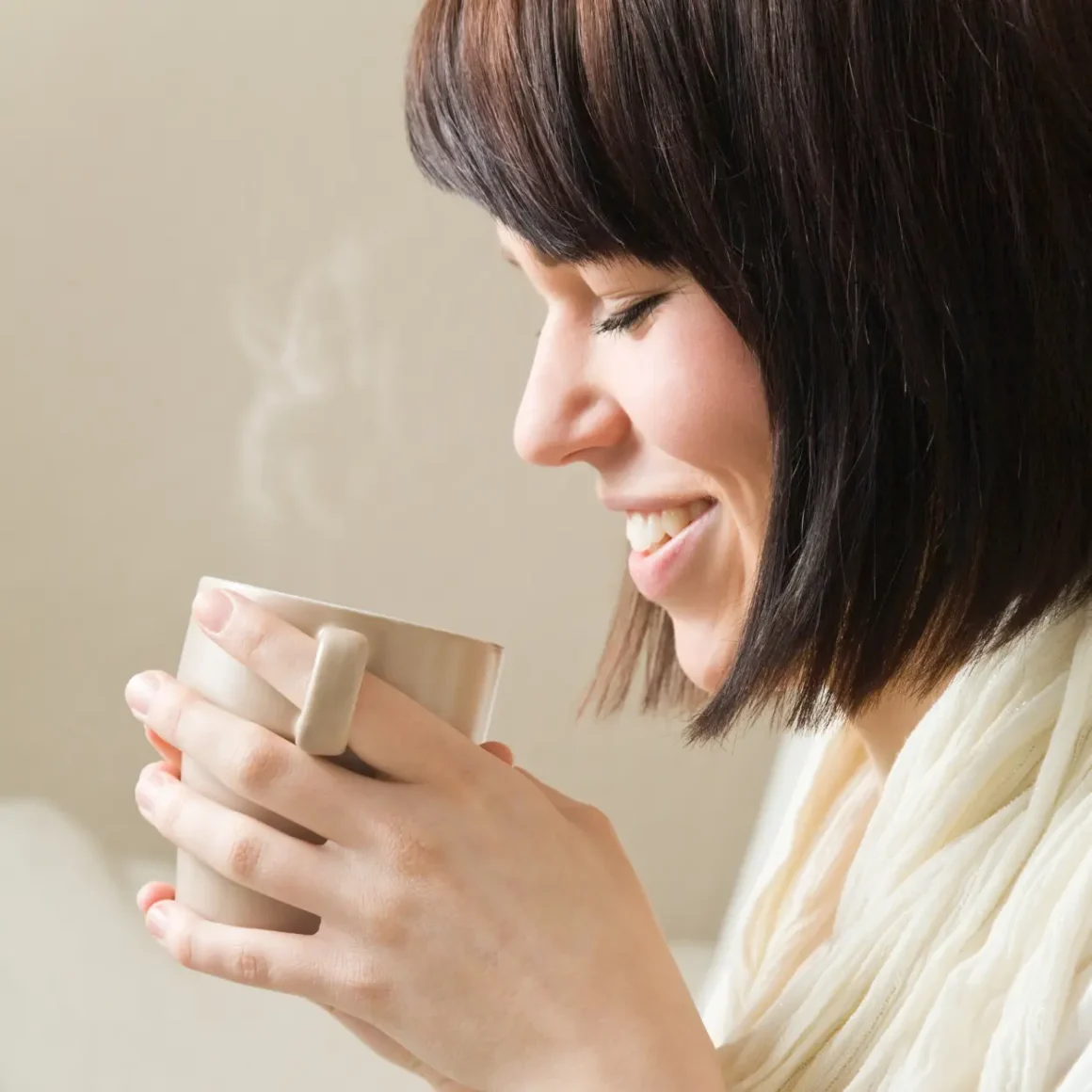 woman holding a cup of coffee