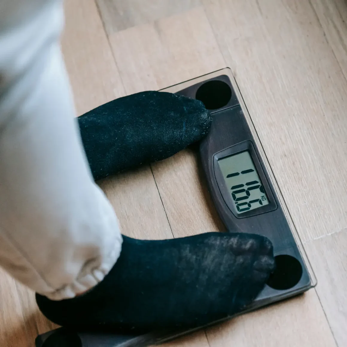 a person standing on a weight scale