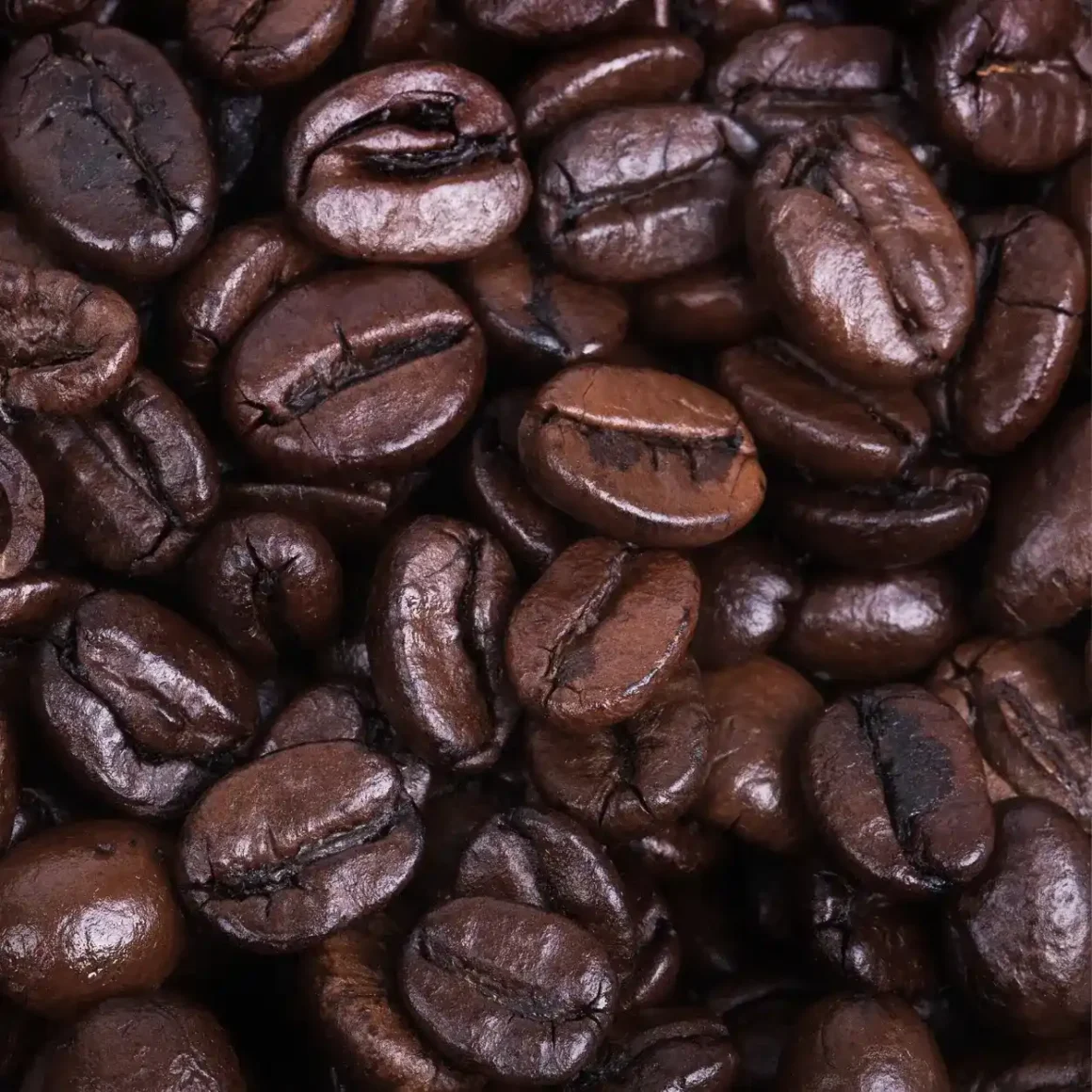 a pile of full city roast coffee beans