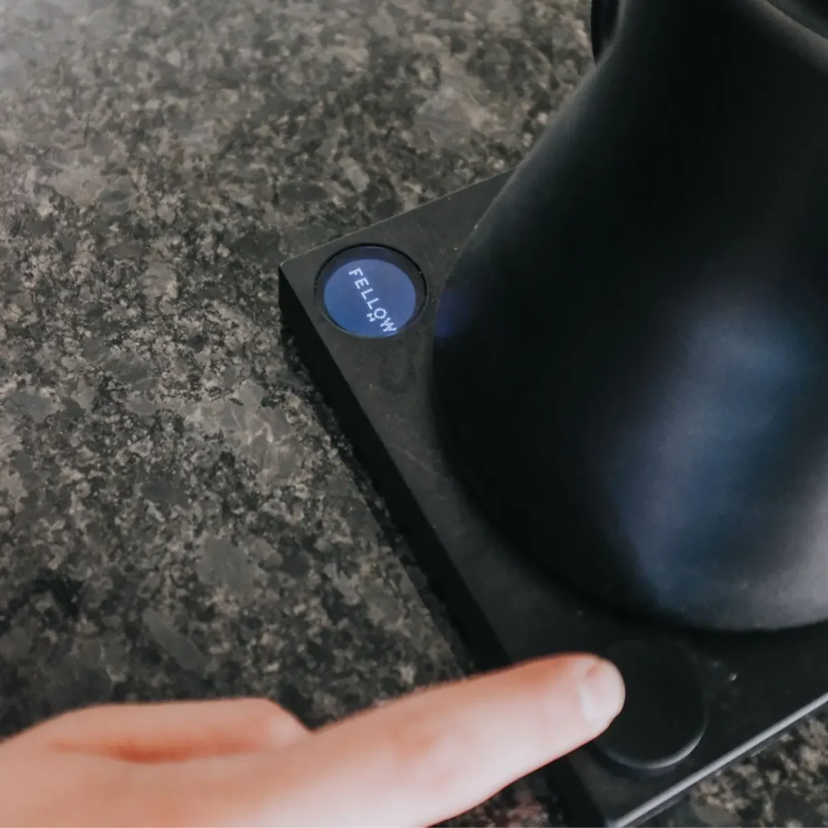 a finger pressing a button