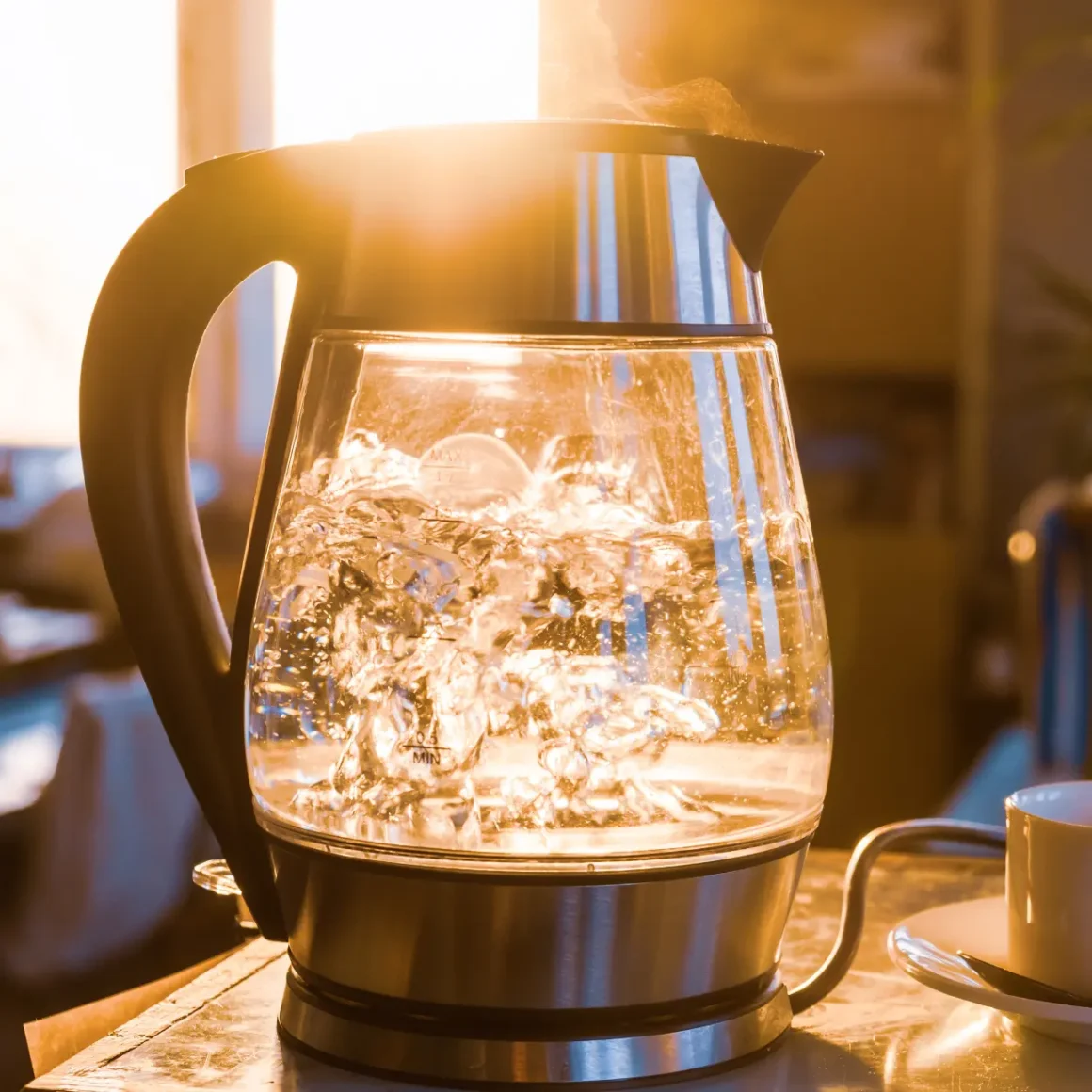 water boiling in a electric coffee kettle on a table
