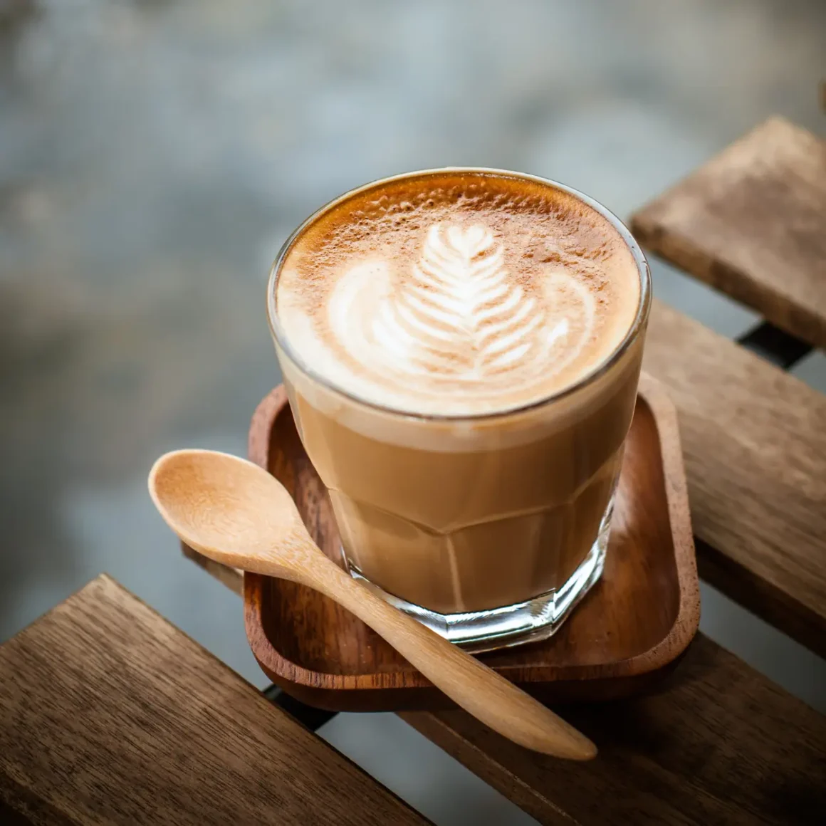 a cup of cortado coffee with a spoon