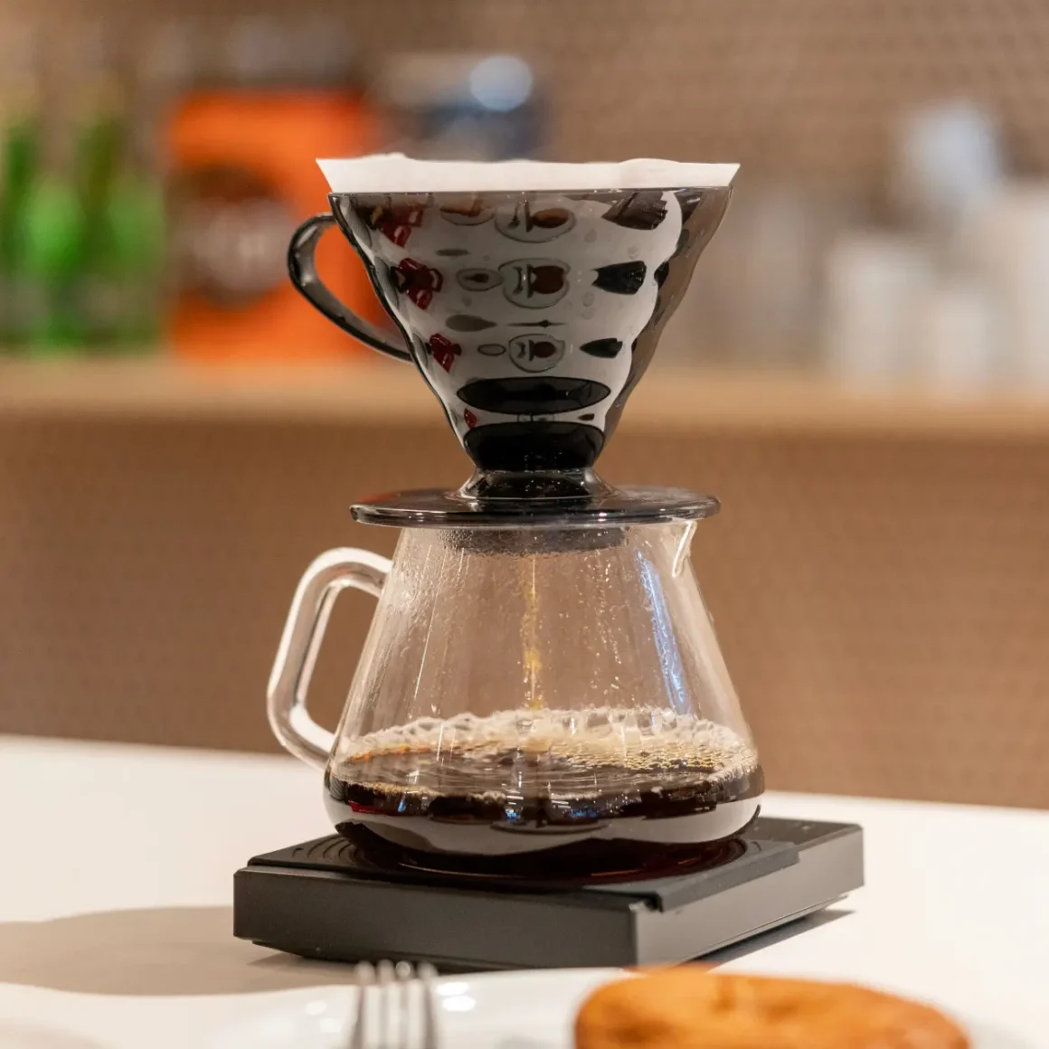 a v60 coffee maker with a filter on top