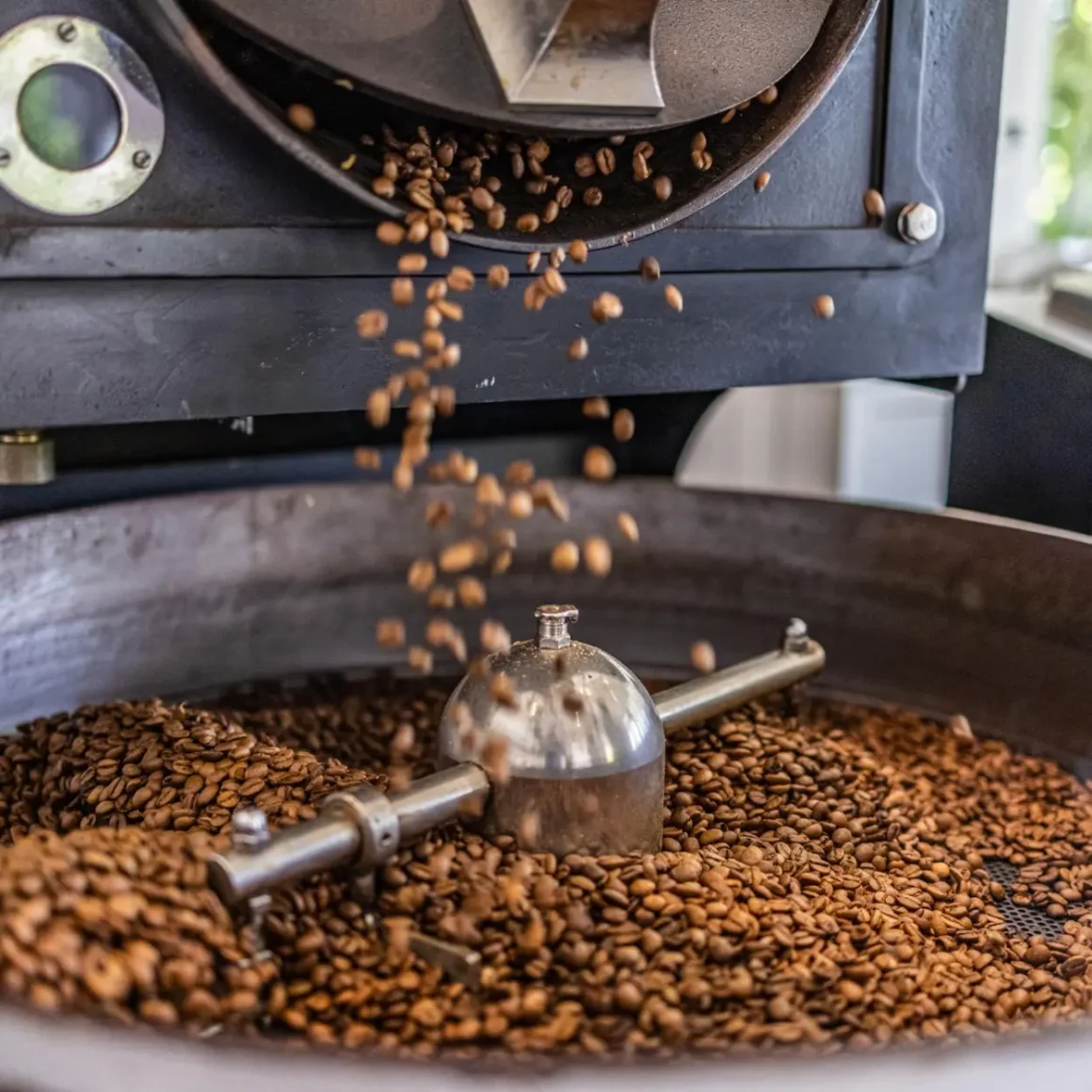 a coffee beans being roasted into a machine