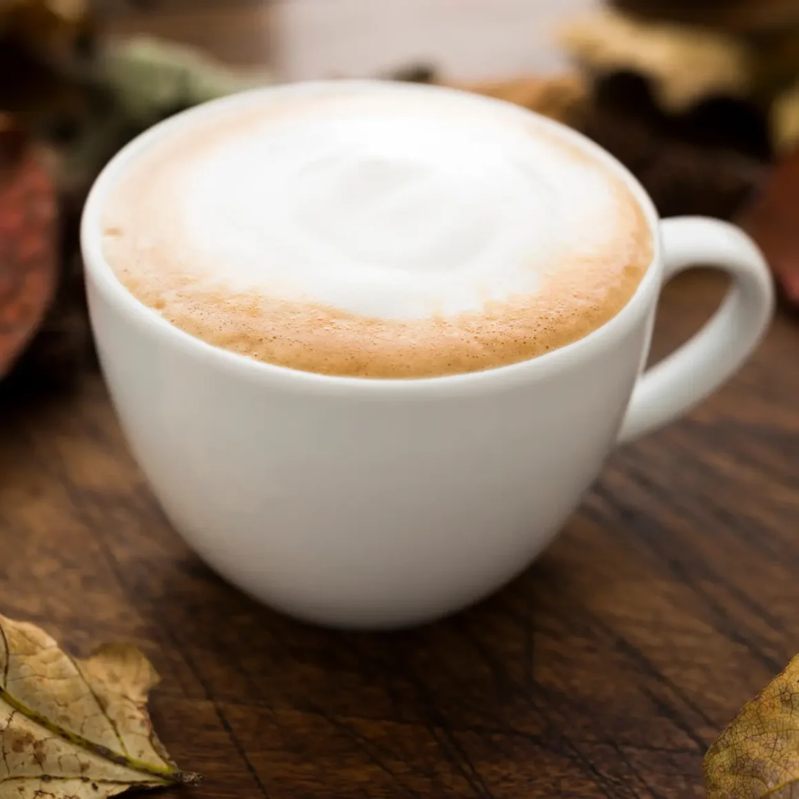 a cup of dry cappuccino coffee with foam in it