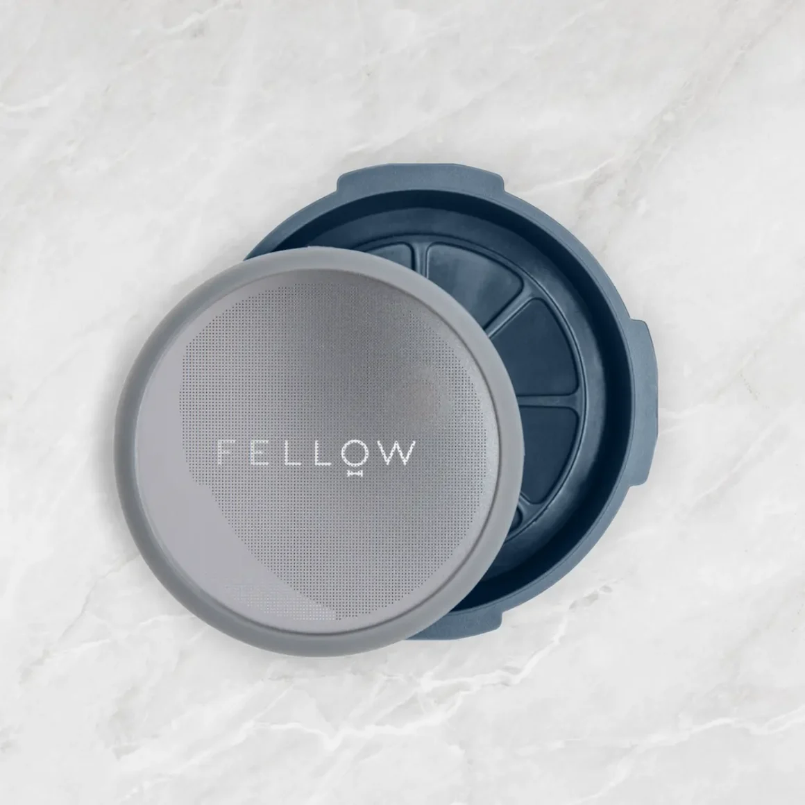 a fellow prismo coffee flow control filter cap on a surface