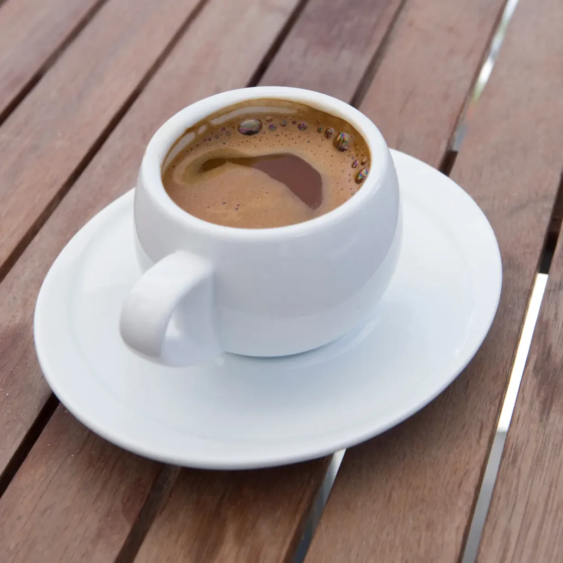 a cup of greek coffee on a saucer