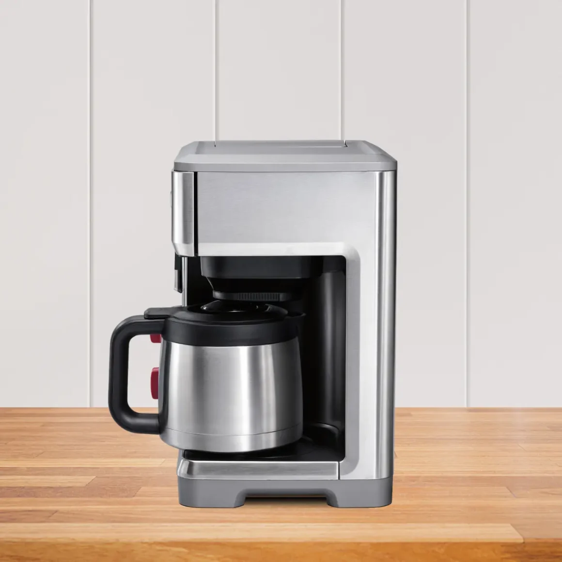 a wolf gourmet 10 cup coffee maker on a wooden table