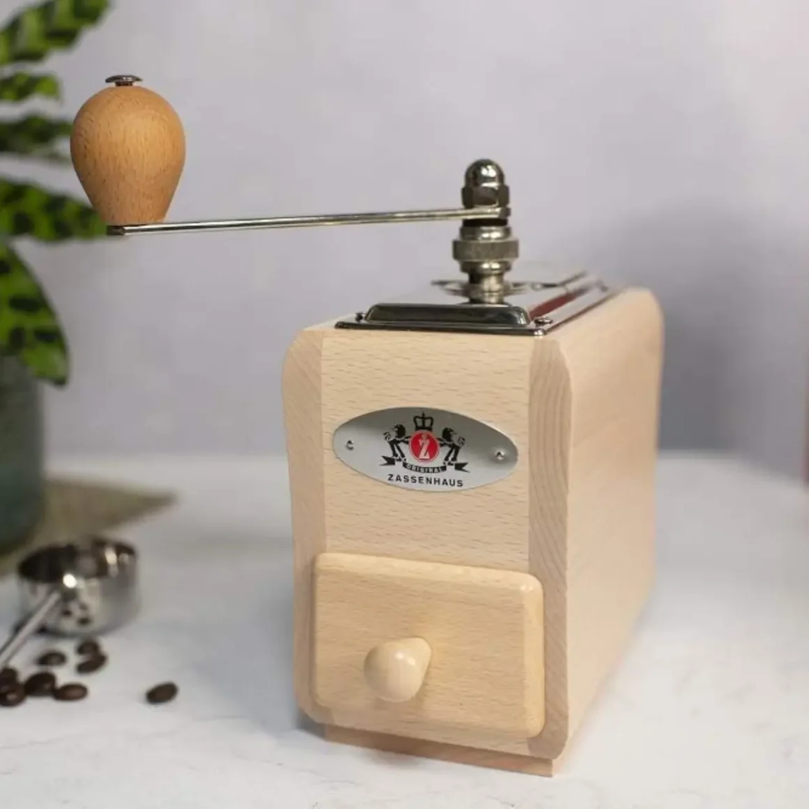 a zassenhaus santiago coffee mill grinder with a wooden handle