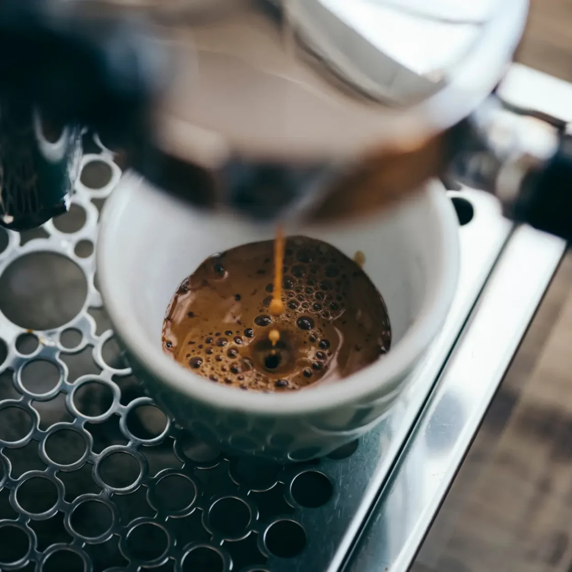 a coffee machine pouring a cup of coffee