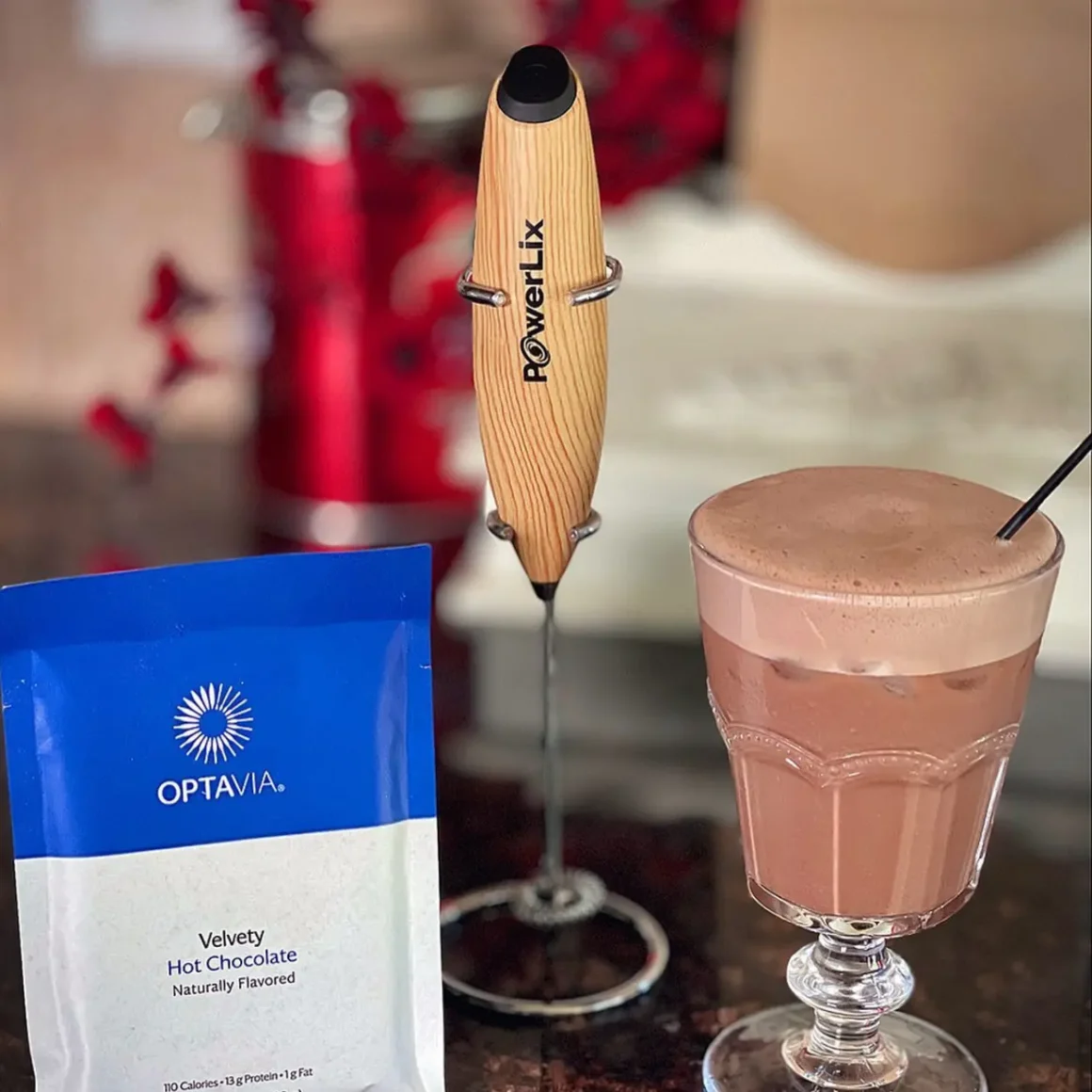 a powerlix on a table next to a glass of coffee