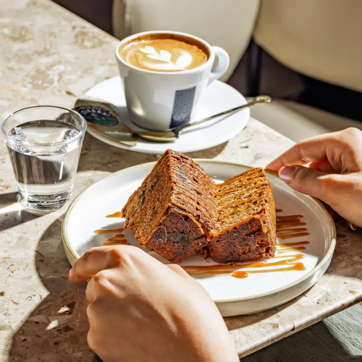 a plate of food and a cup of coffee