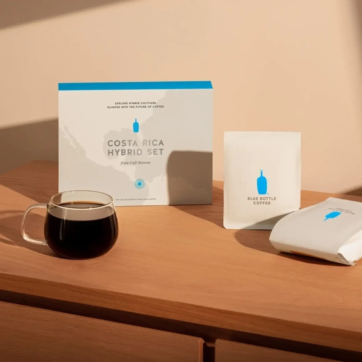 a coffee cup and a coffee package on a table