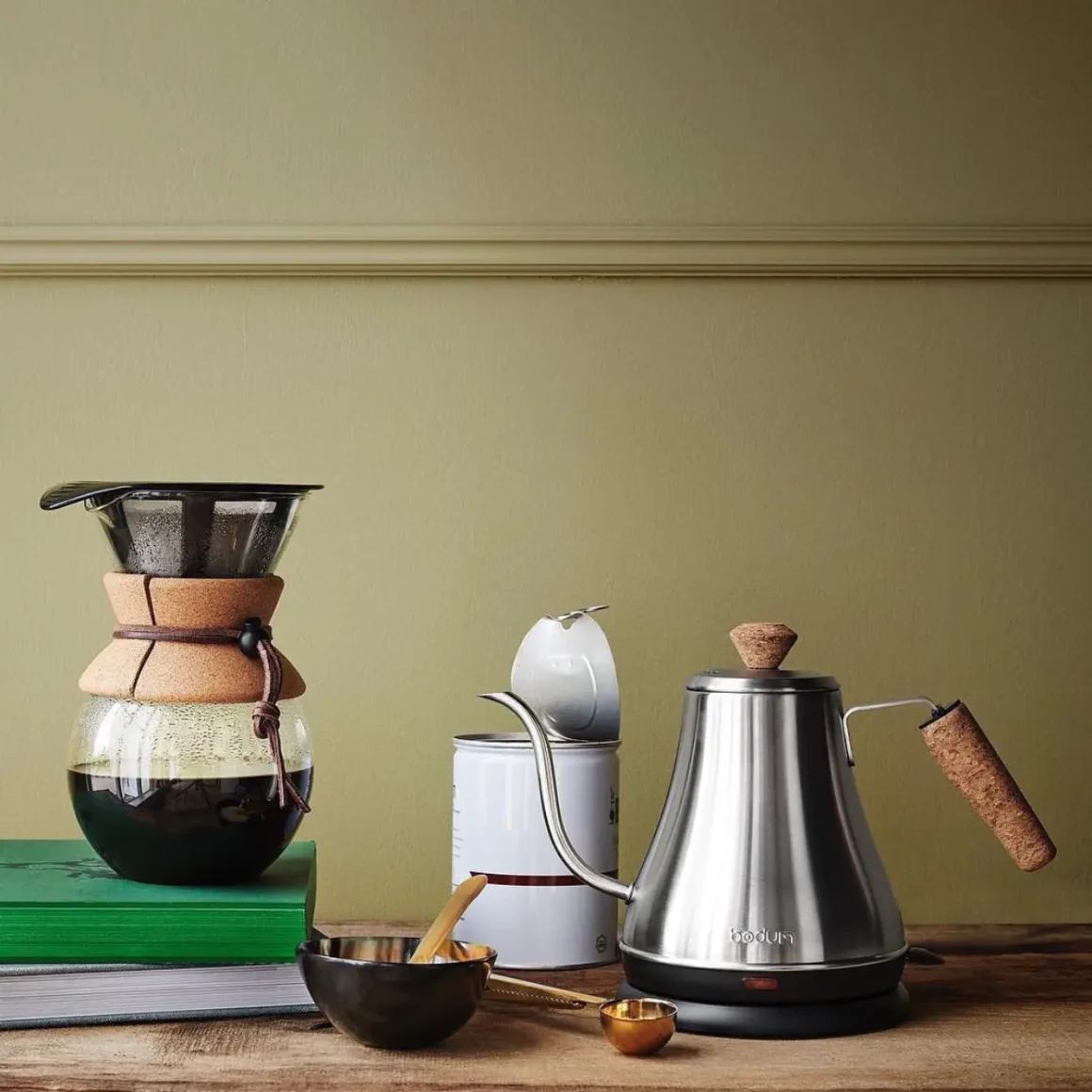 a coffee maker and a bodum melior gooseneck water kettle on a table