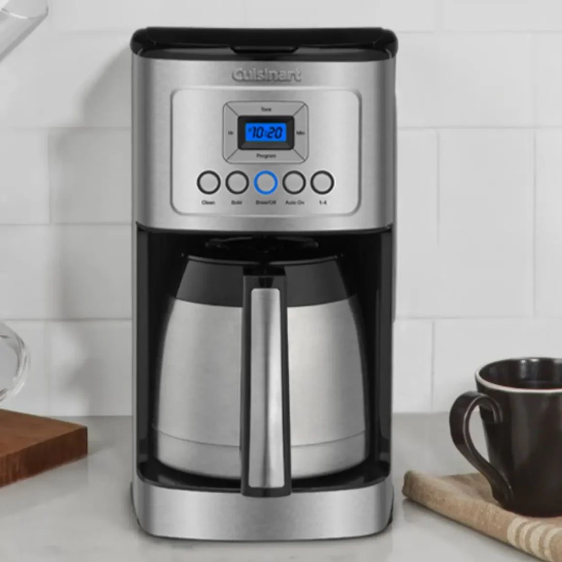 a cuisinart stainless steel 12-cup coffee maker on a counter