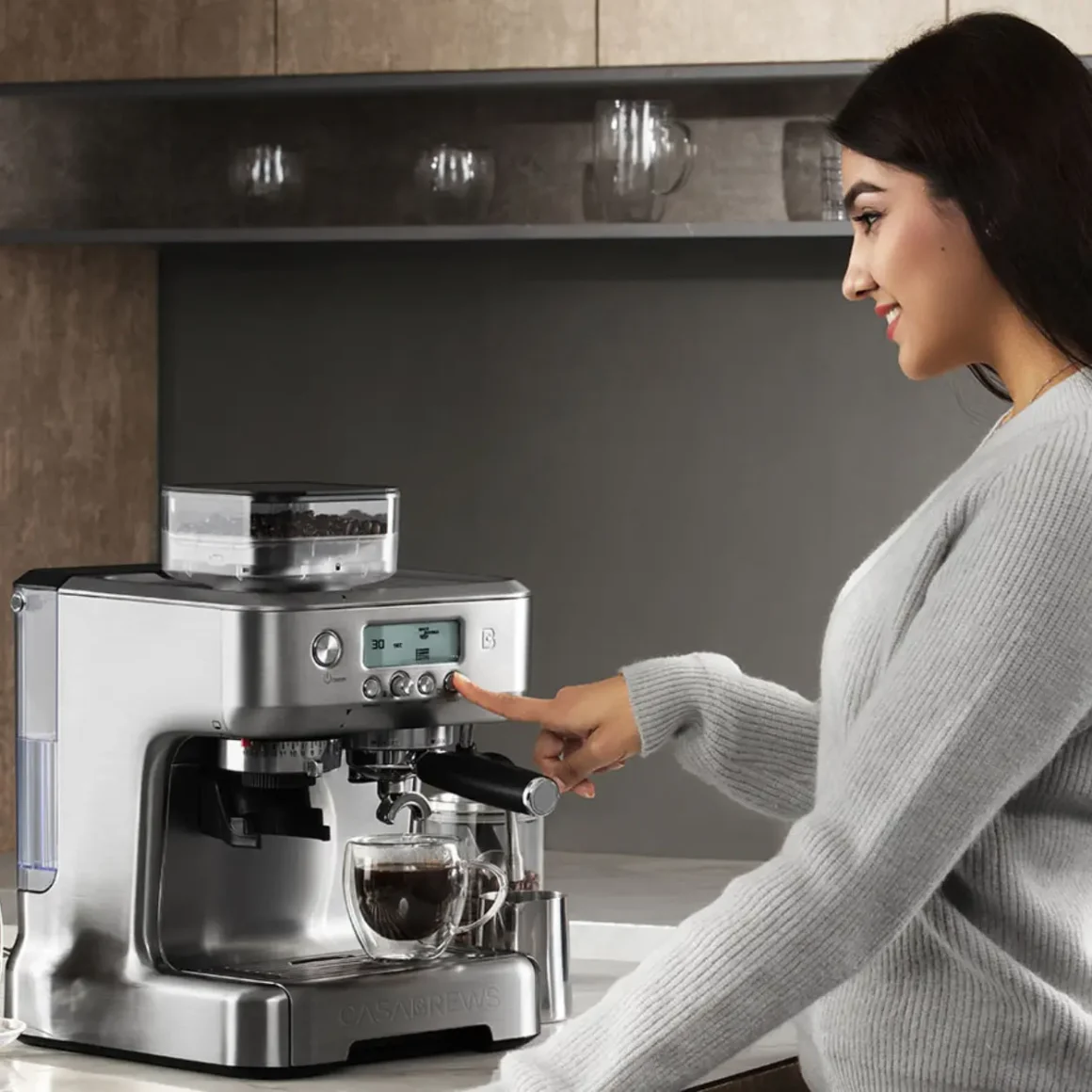 a woman using a casabrews 5700 pro espresso machine
