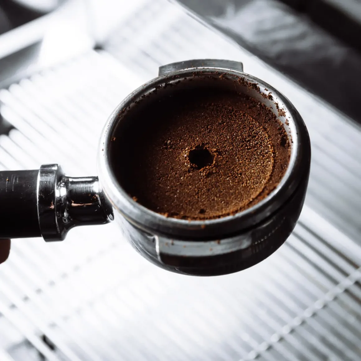 a bottomless portafilter with ground coffee