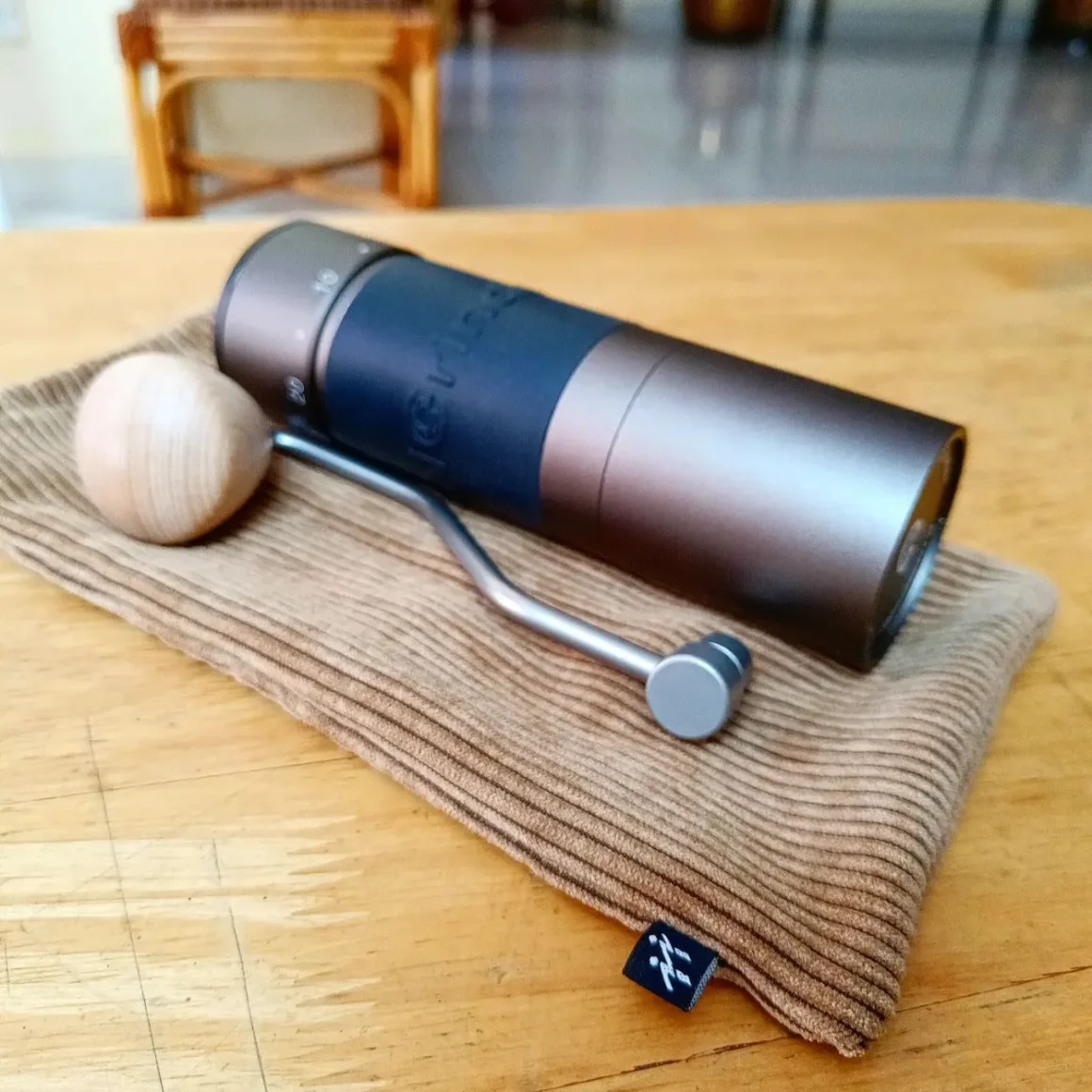 a kingrinder k6 coffee grinder on a brown cloth