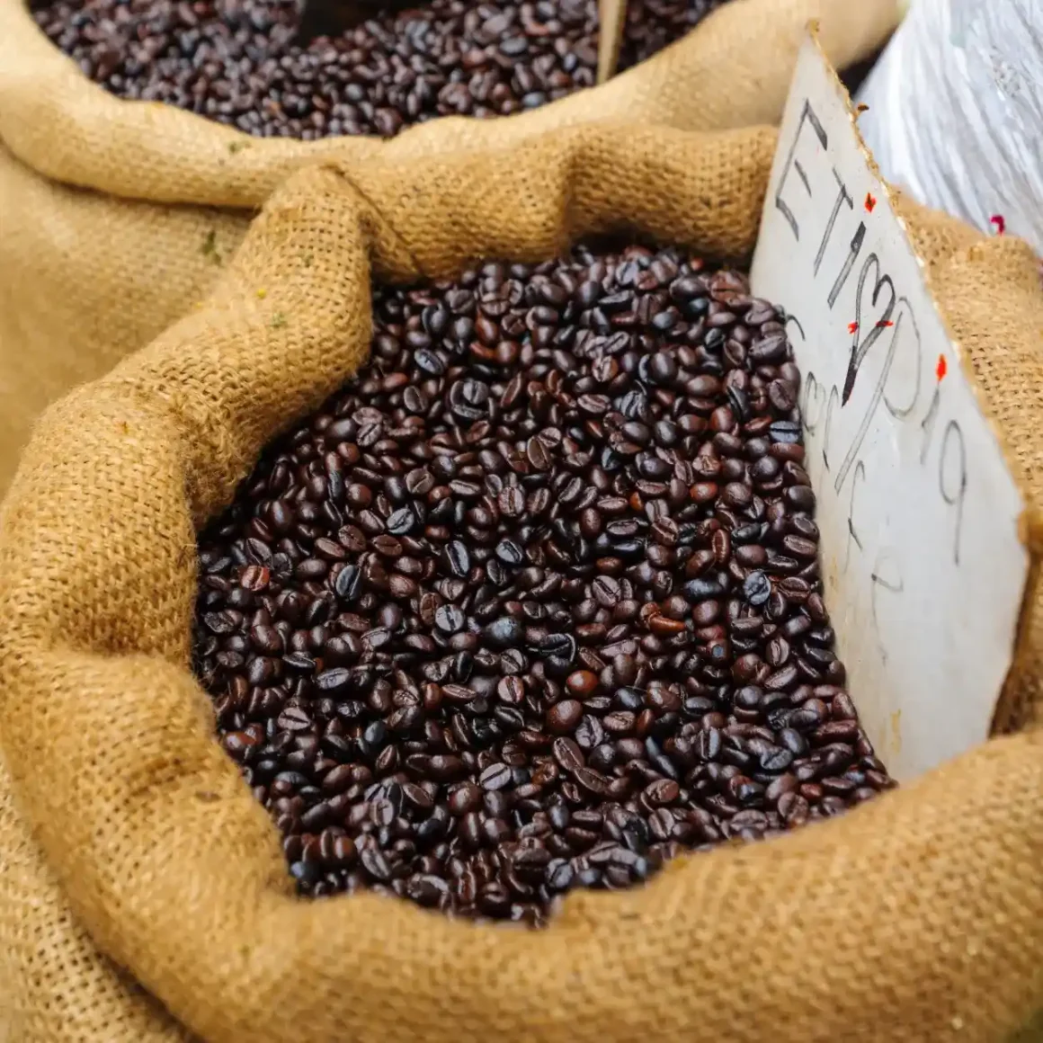 a group of burlap sacks of Ethiopian coffee beans