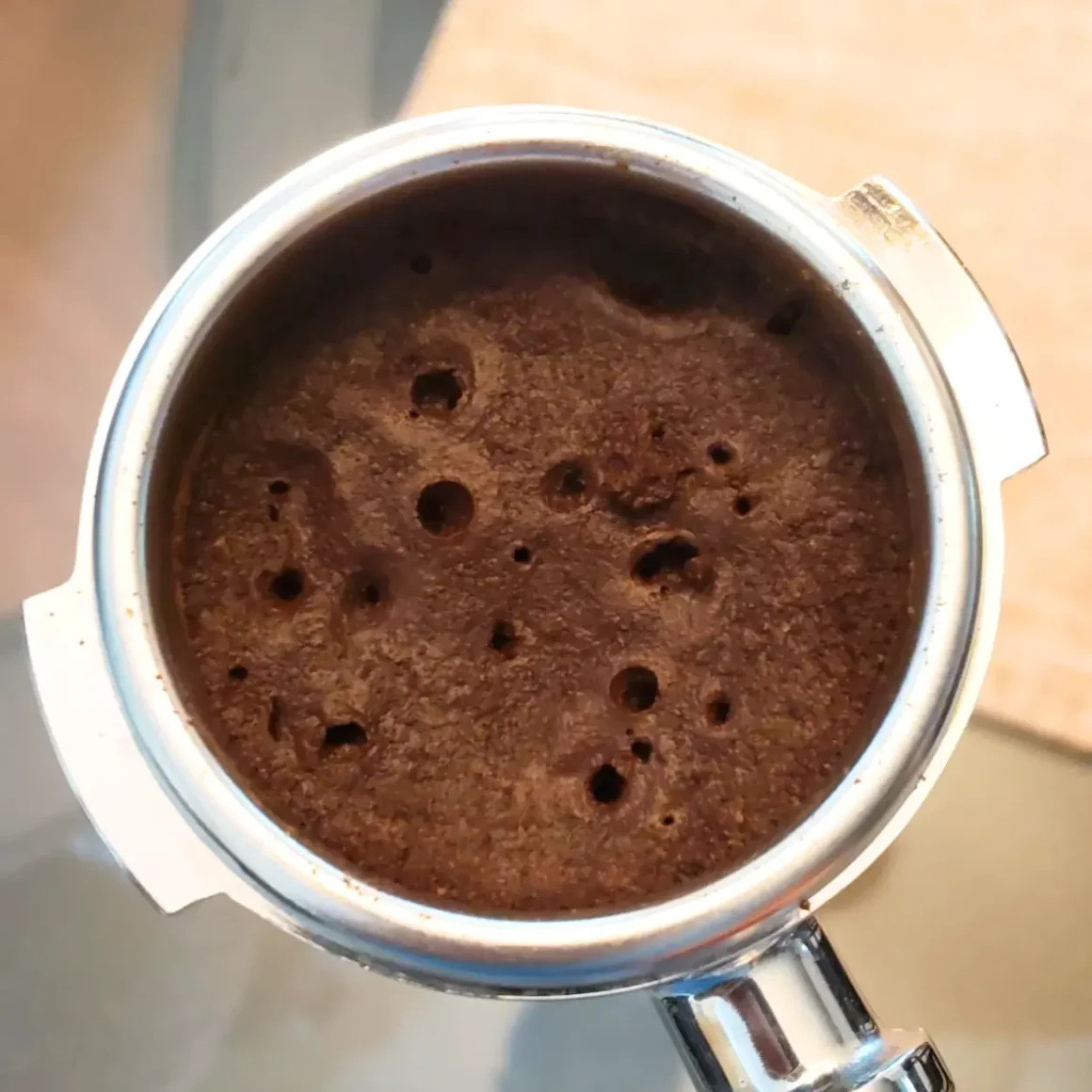 a portafilter with ground coffee in it