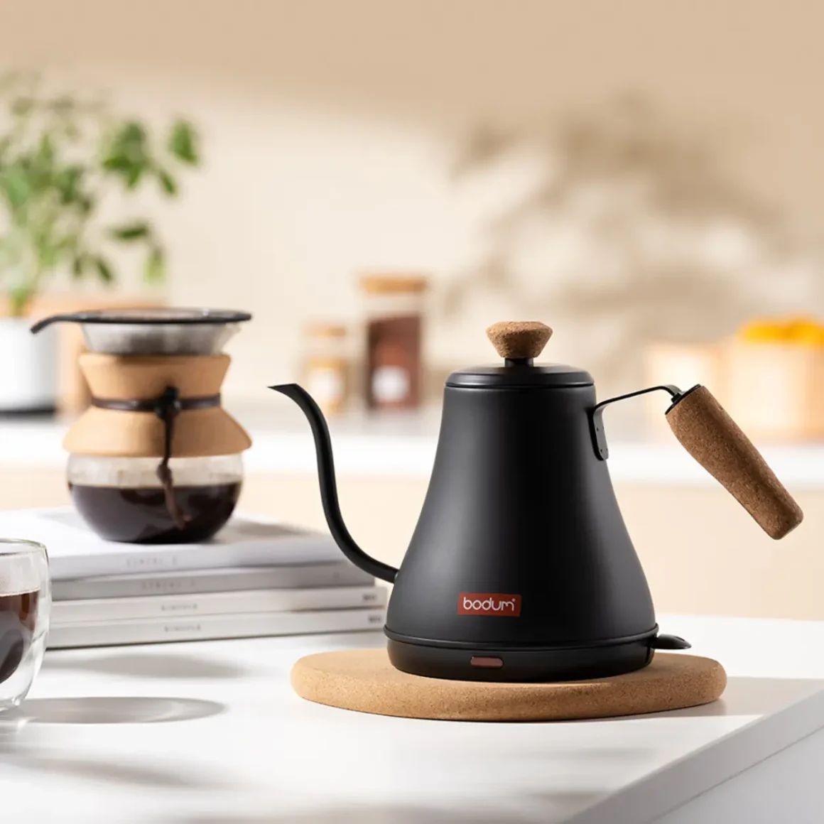 a black bodum melior gooseneck water kettle on a white surface