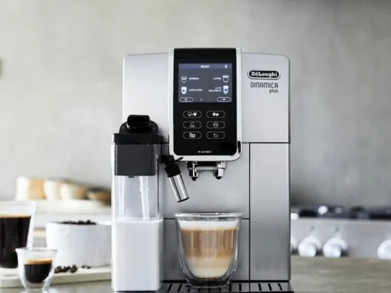 a delonghi dinamica plus coffee maker on a counter