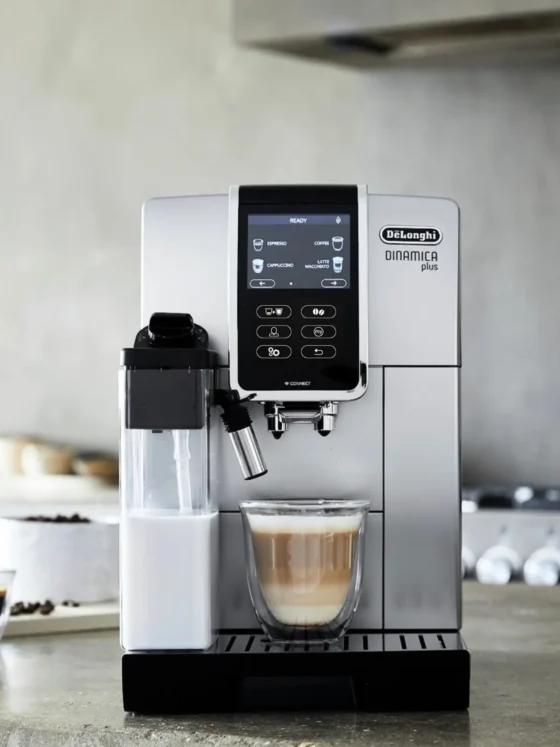 a delonghi dinamica plus coffee maker on a counter