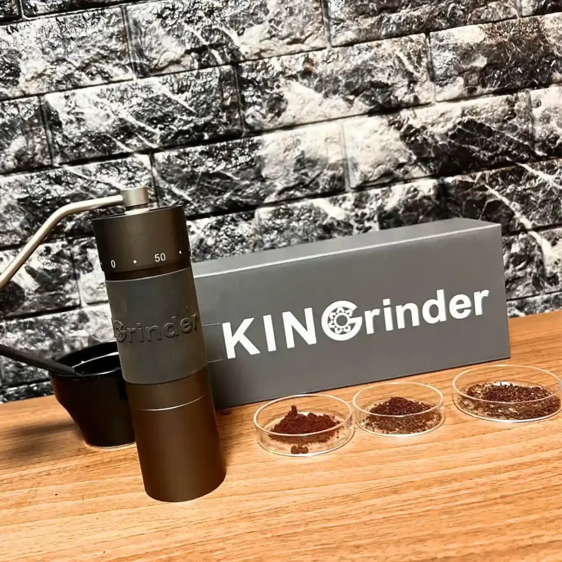 a kingrinder k6 coffee grinder and a container on a table