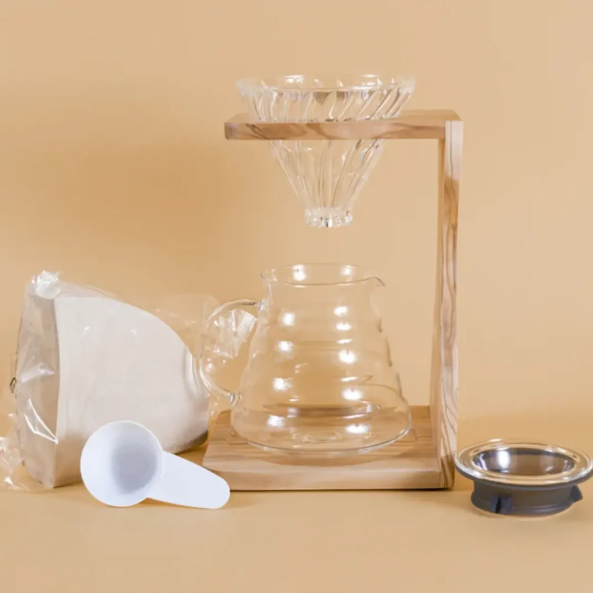 a hario v60 olive coffee pour-over coffee stand set and a measuring cup